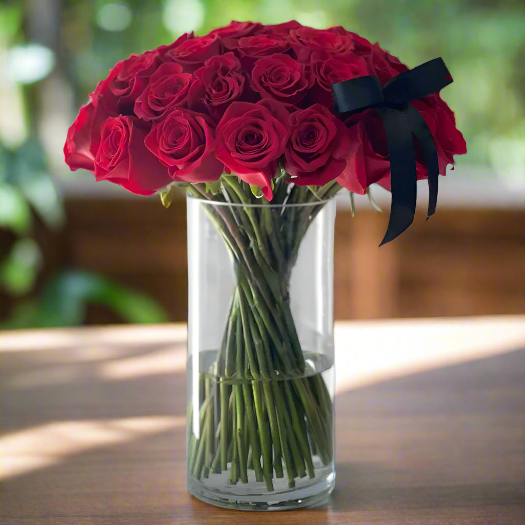 Roses And Stems In A Glass Vase
